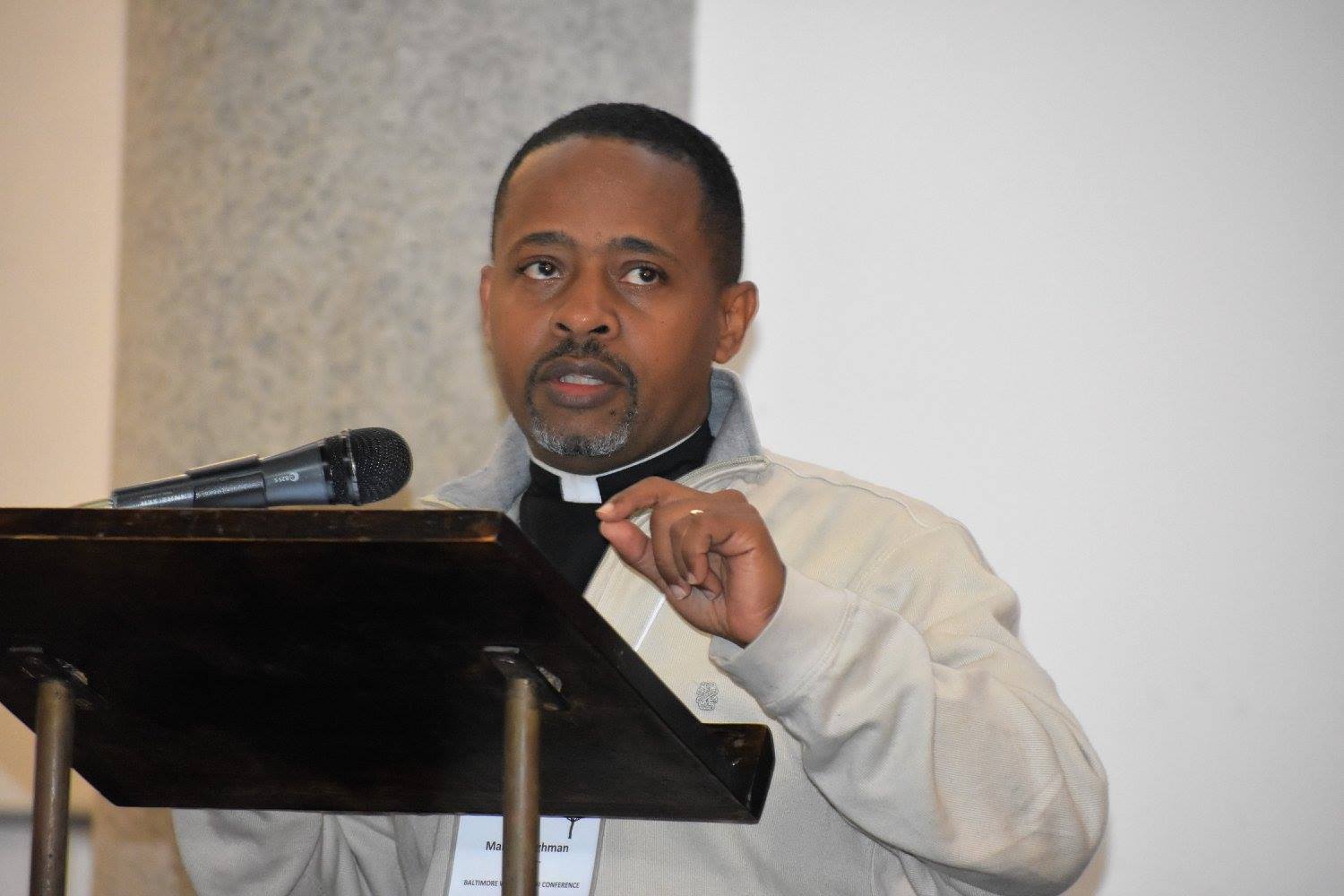 Marlon at pulpit with mike